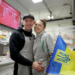 smiling couple with Ukrainian flag