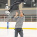 female figure skater being tossed in the air by her partner